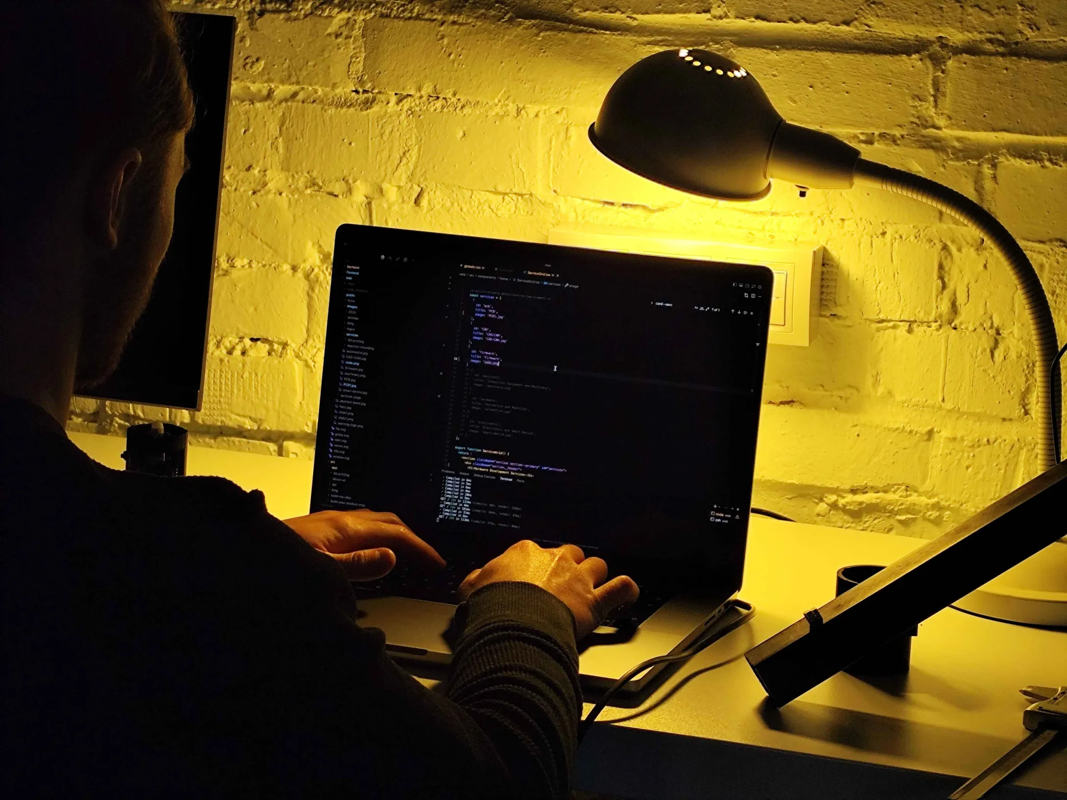 Close-up of a green PCB with firmware tools.